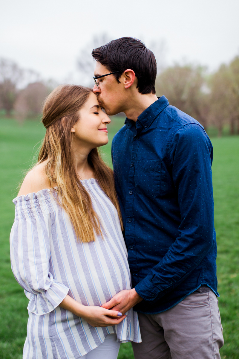  Kansas City Loose Park spring maternity session husband kissing forehead Kansas City Maternity photographer 