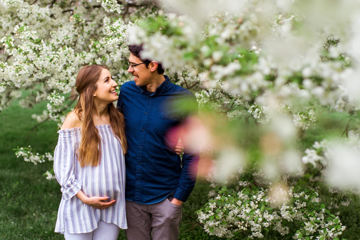 Kansas City Loose Park spring maternity session with the flowering apple tree Kansas City maternity photographer