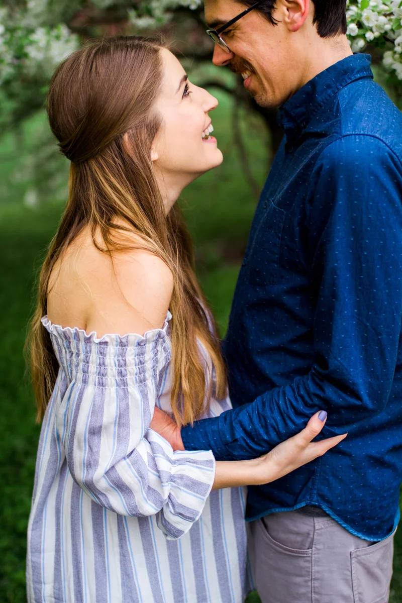 Kansas City Loose Park spring maternity session with the flowering apple tree Kansas City maternity photographer black and white photo