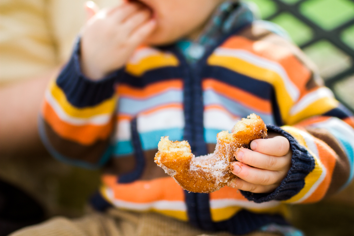  Kansas City family photographer toddler eating a donut Cider Hill Family Orchard 