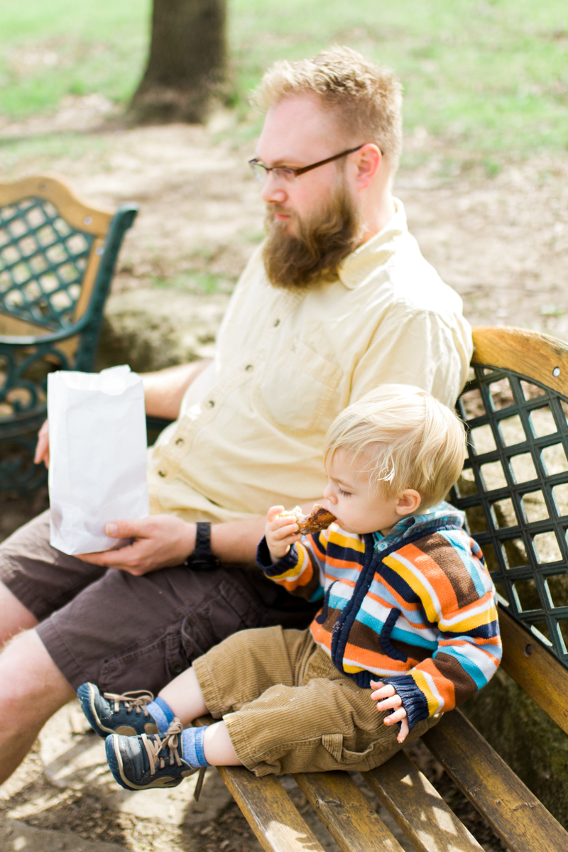  Kansas City family photographer father and son eating a donut Cider Hill Family Orchard 