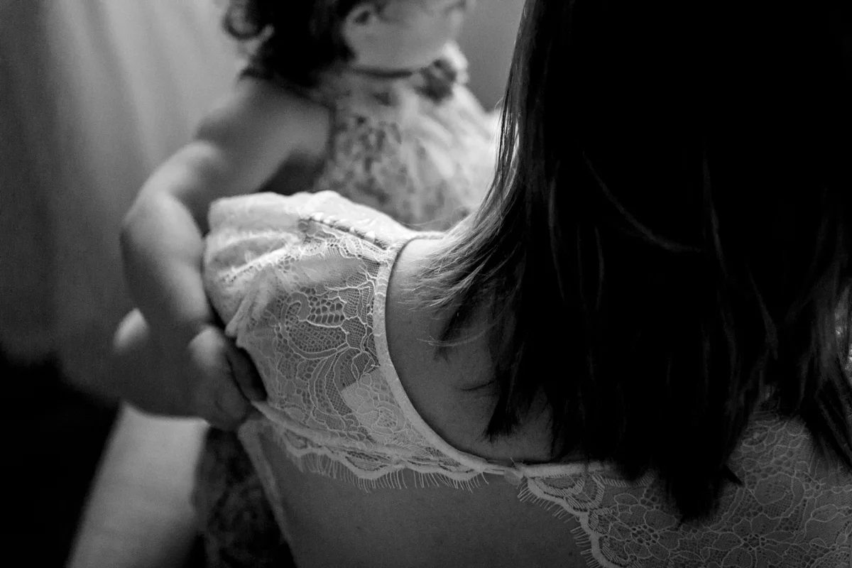 Kansas City Family photographer, in-home lifestyle family photography mother and daughter reading black and white photo Rebecca Clair Photography