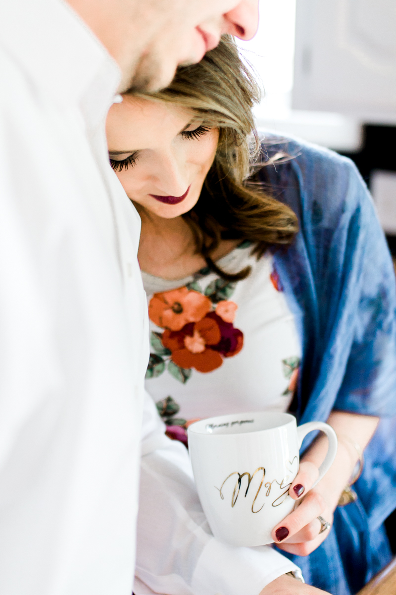  Kansas City lifestyle photographer in home couples session cuddling in the kitchen with coffee engagement photos 