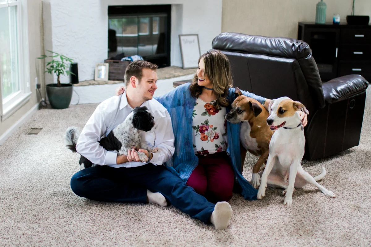 Kansas City lifestyle photographer in home couples session with their dogs engagement photos
