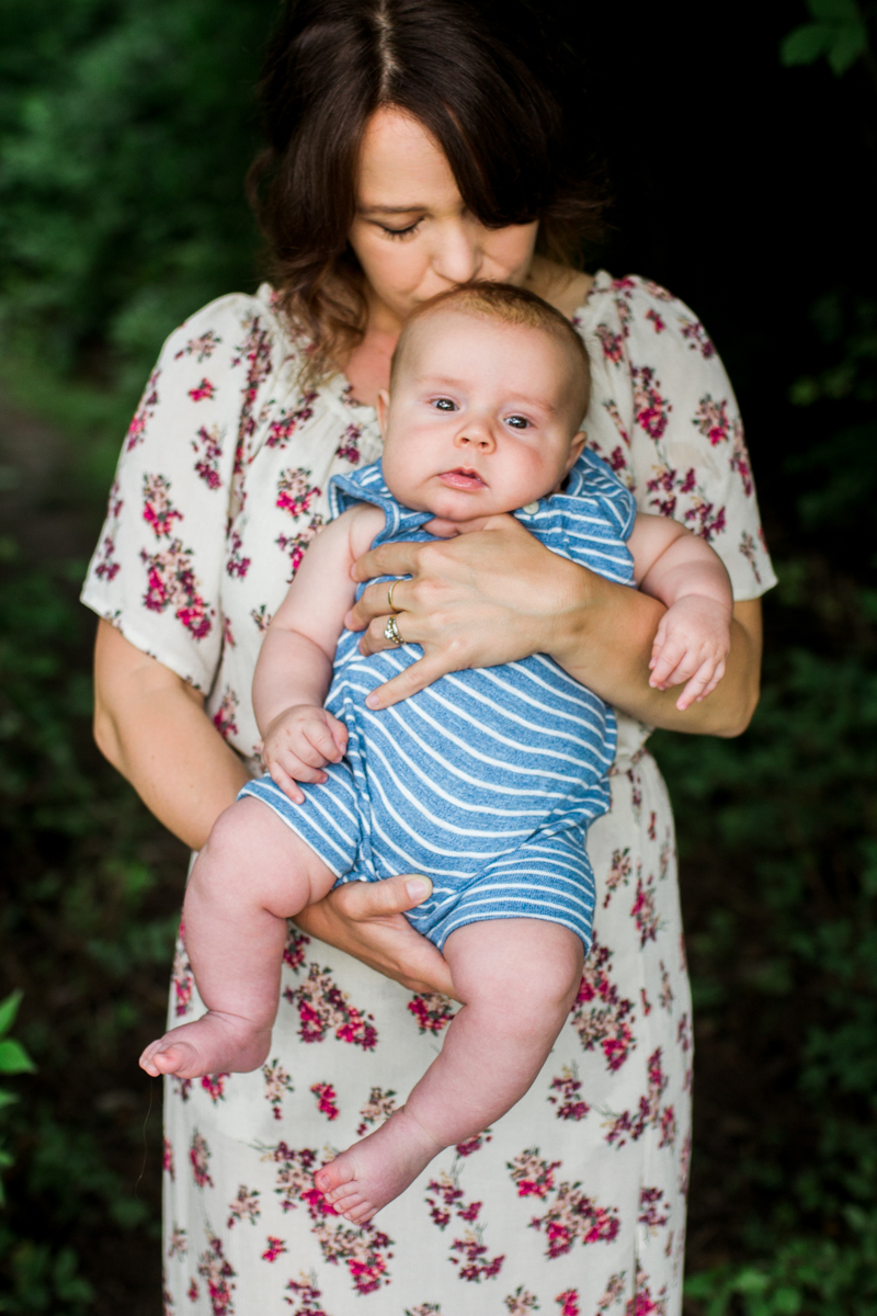  Rebecca Clair Photography Kansas City MO lifestyle family photographer Line Creek Trail Family Session mother holding son and kissing his head 
