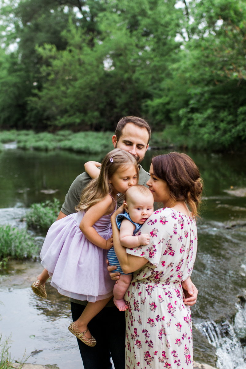  Rebecca Clair Photography Kansas City MO lifestyle family photographer Line Creek Trail Family Session sister kissing her brother's head 