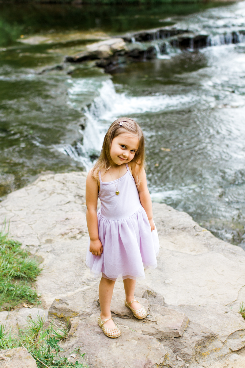  Rebecca Clair Photography Kansas City MO lifestyle family photographer Line Creek Trail Family Session little girl by a waterfall 