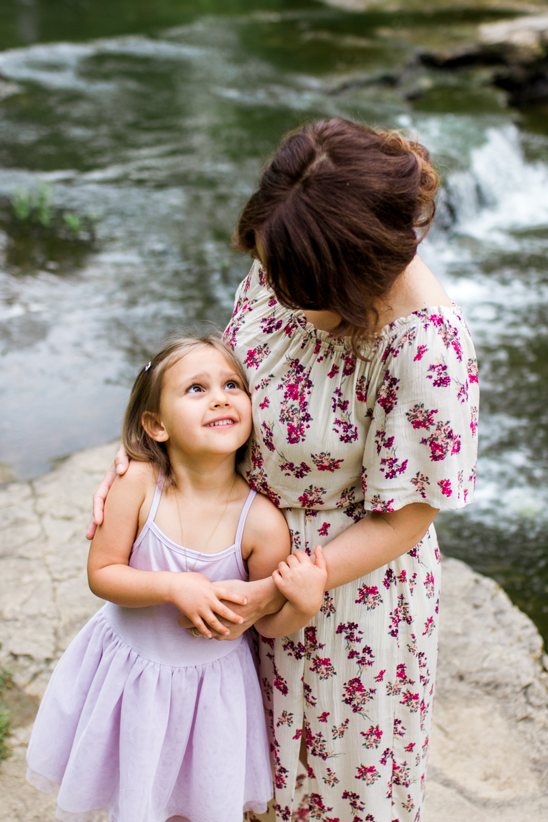  Rebecca Clair Photography Kansas City MO lifestyle family photographer Line Creek Trail Family Session daughter looking up at her mother 