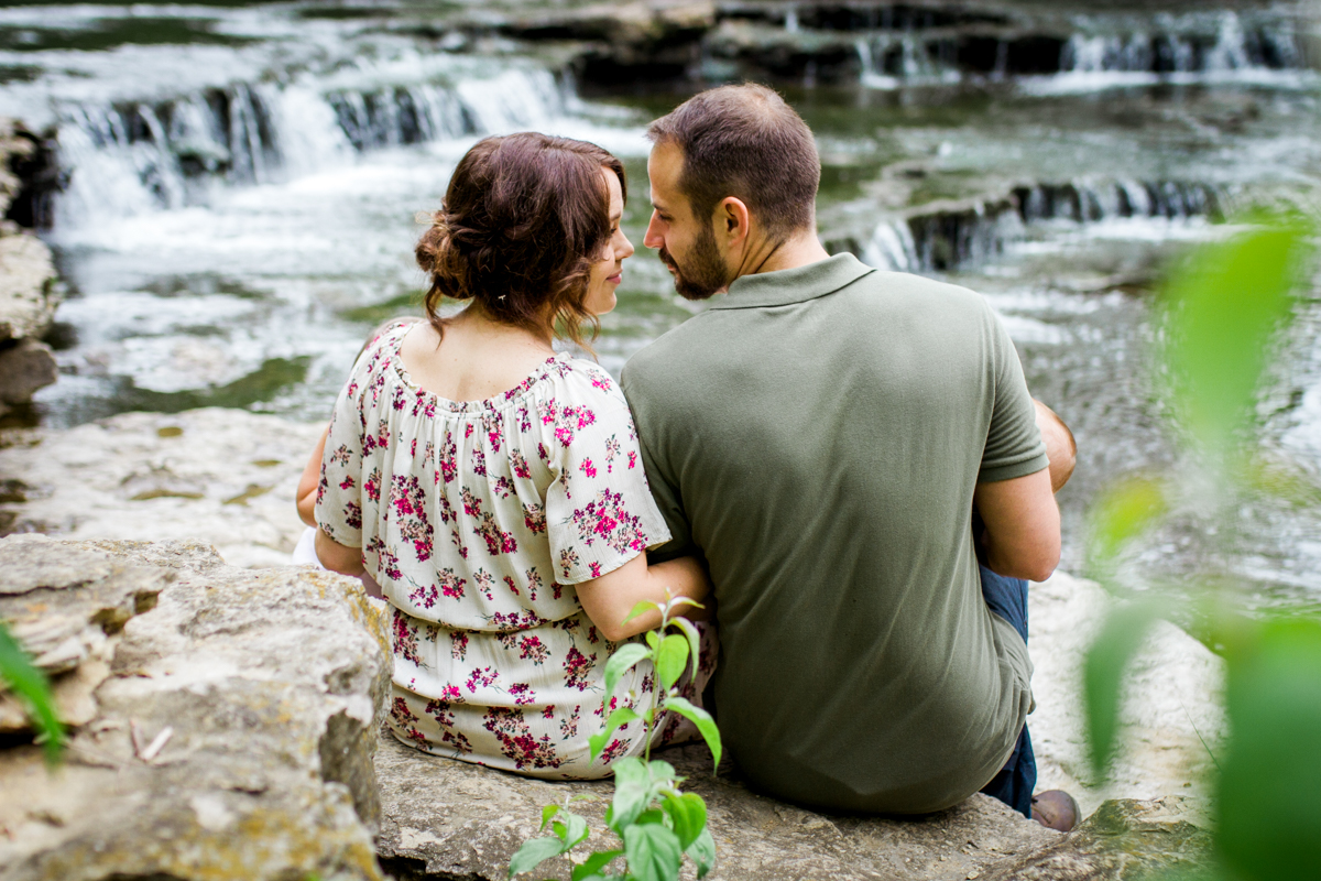  Rebecca Clair Photography Kansas City MO lifestyle family photographer Line Creek Trail Family Session couple about to kiss by waterfall couples photography 