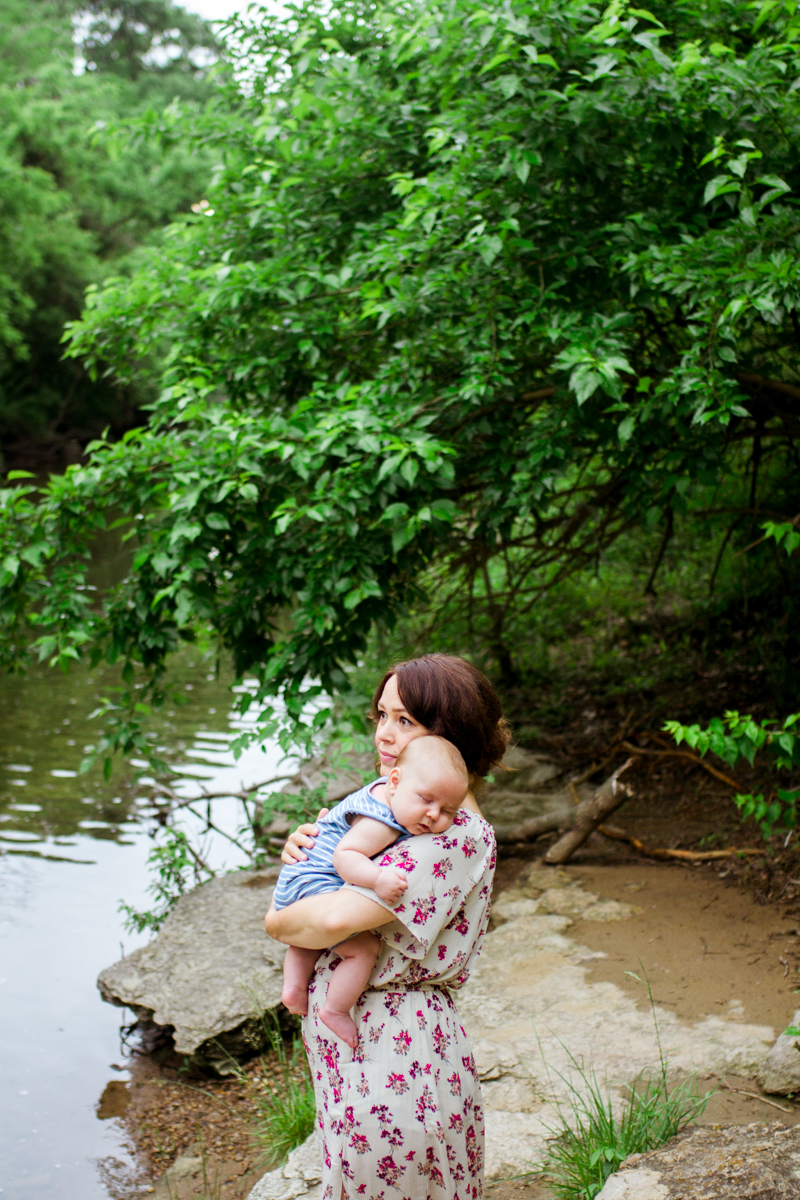  Rebecca Clair Photography Kansas City MO lifestyle family photographer Line Creek Trail Family Session mother holding baby by the creek 