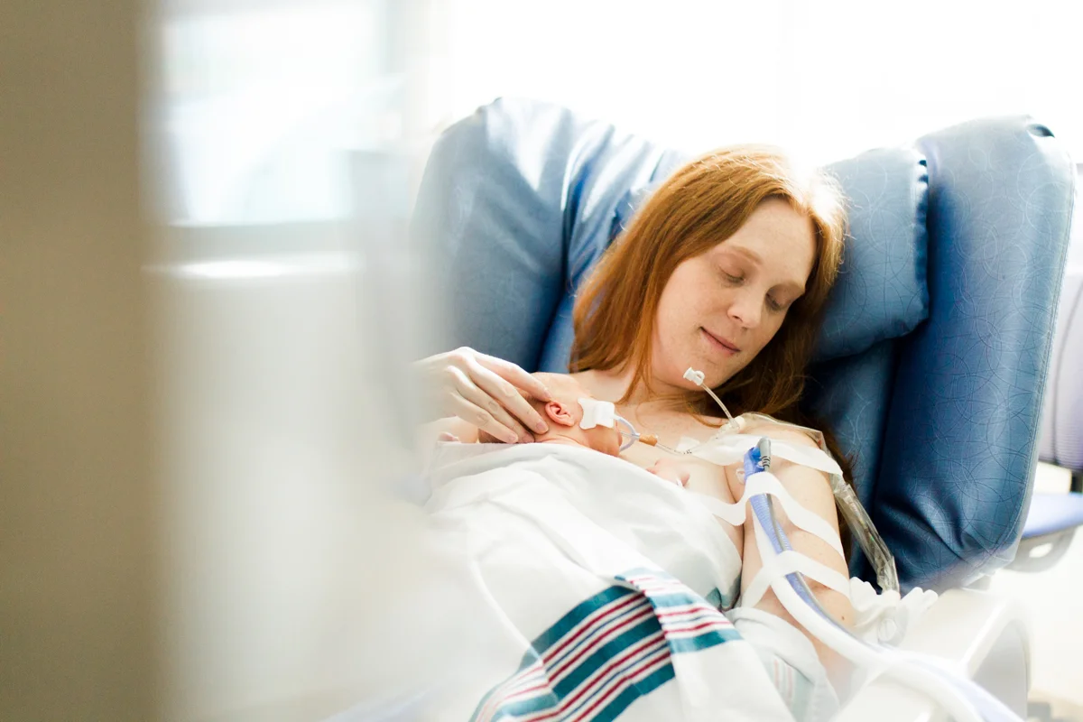 Rebecca Clair Photography lifestyle NICU newborn photography Children's Mercy Hospital mother doing skin to skin with her baby