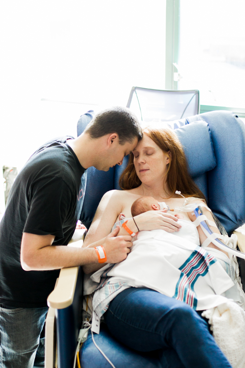  Rebecca Clair Photography lifestyle NICU newborn photography Children's Mercy Hospital parents holding their baby 