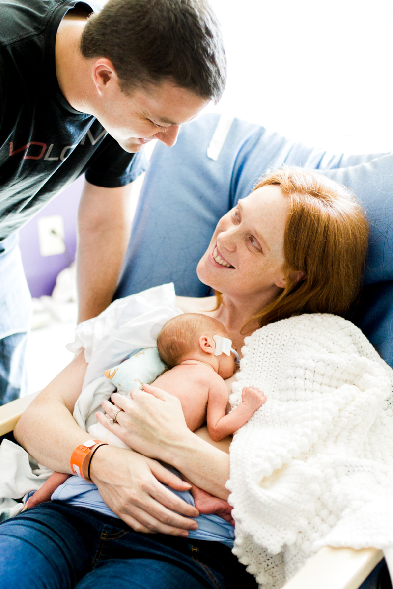  Rebecca Clair Photography lifestyle NICU newborn photography Children's Mercy Hospital mother and father looking at each other 