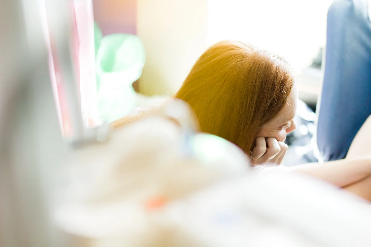 Rebecca Clair Photography lifestyle NICU newborn photography Children's Mercy Hospital mother with closed eyes