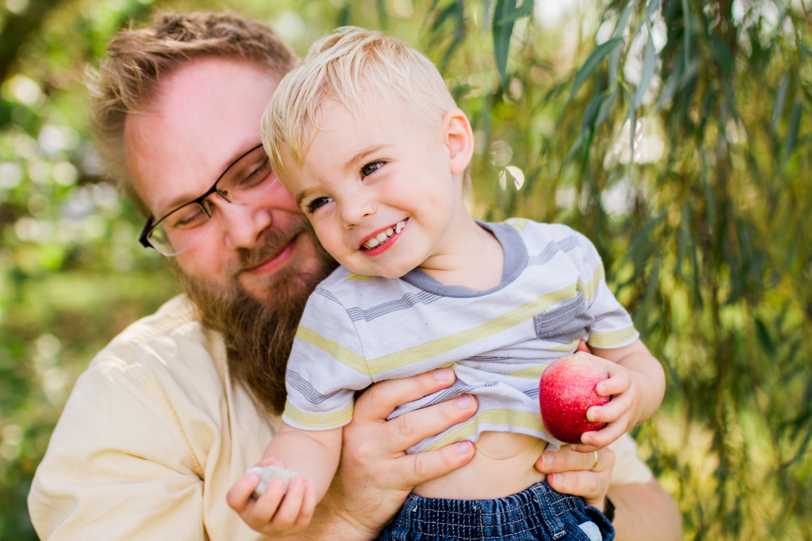  Rebecca Clair Photography, Kansas City lifestyle photographer, apple picking photo session, apple orchard photos, Kansas City family photographer, father holding son 