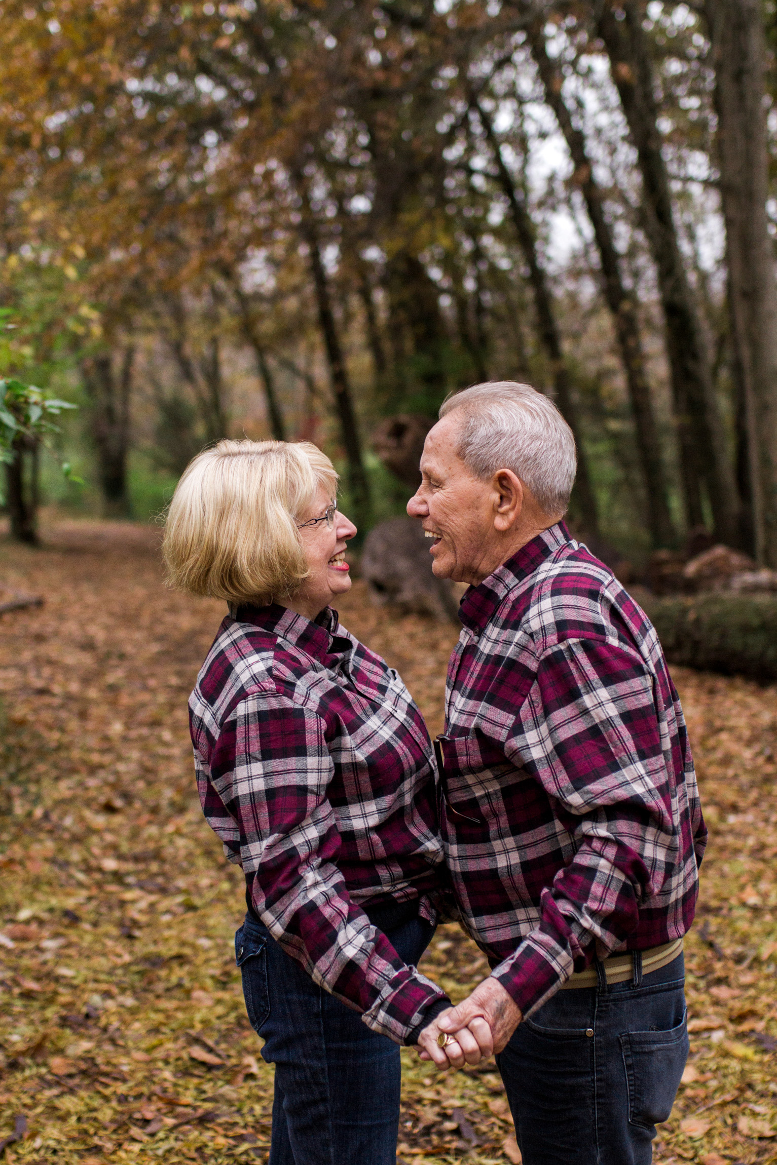  Kansas City lifestyle photographer, Kansas City family photographer, extended family session, fall family photos in the woods, older couple holding hands, grandparents portrait 