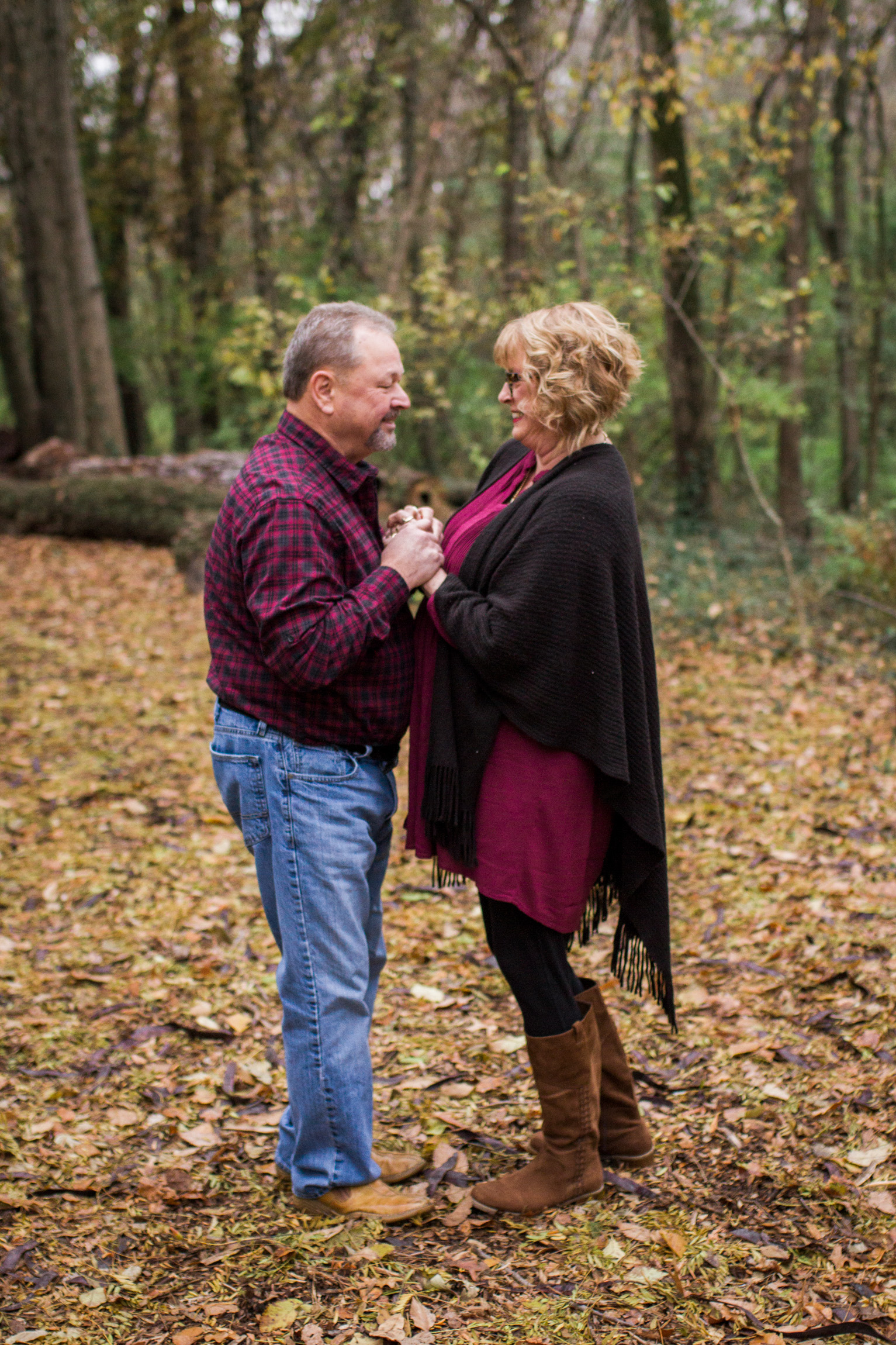  Kansas City lifestyle photographer, Kansas City family photographer, extended family session, fall family photos in the woods, older couple holding hands, grandparents portrait 