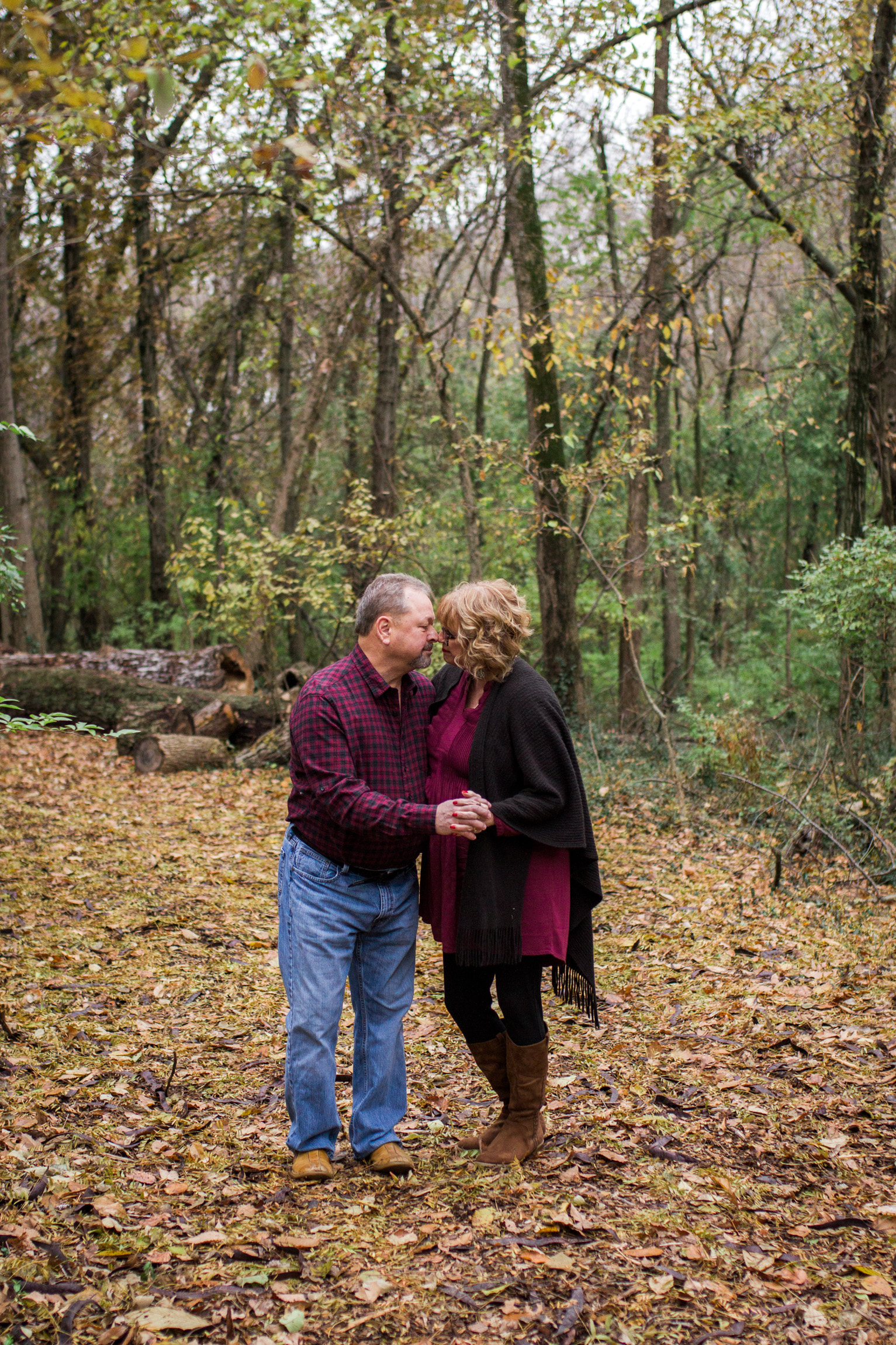  Kansas City lifestyle photographer, Kansas City family photographer, extended family session, fall family photos in the woods, older couple holding hands, grandparents portrait 