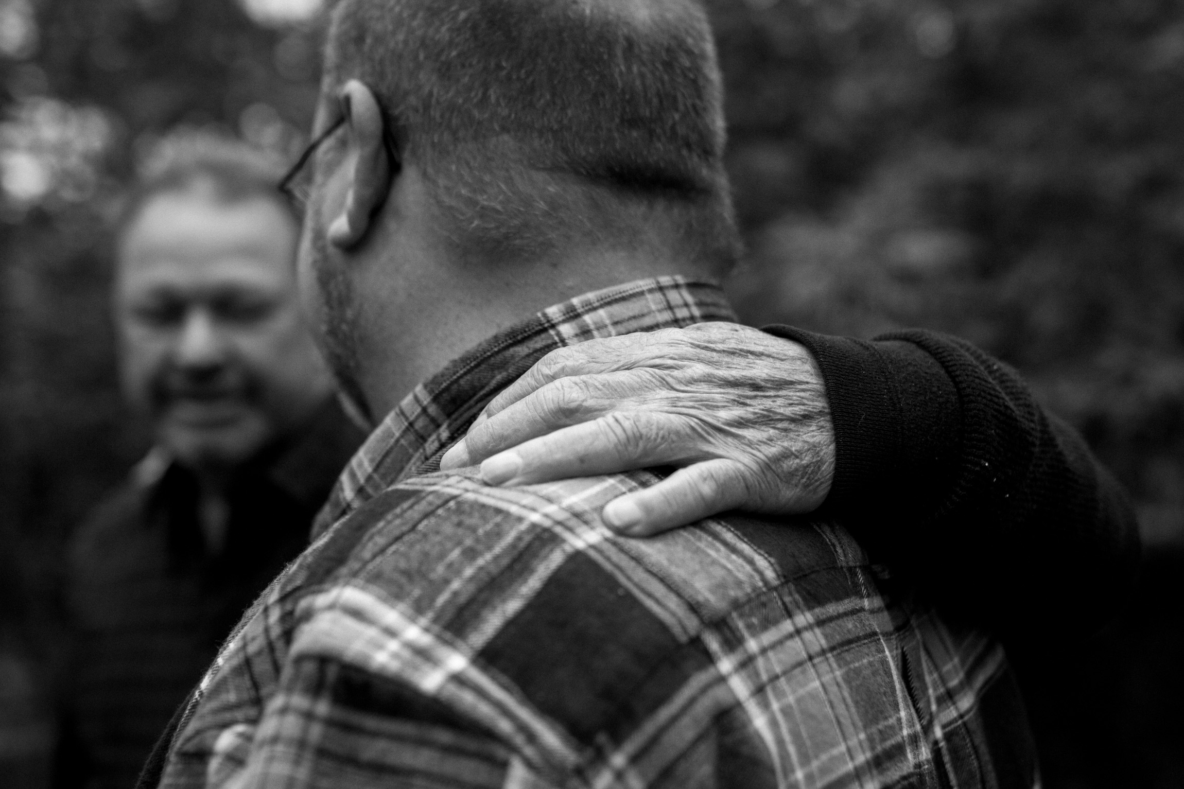  Kansas City lifestyle photographer, Kansas City family photographer, extended family session, fall family photos in the woods, father and grown sons, black and white portrait 