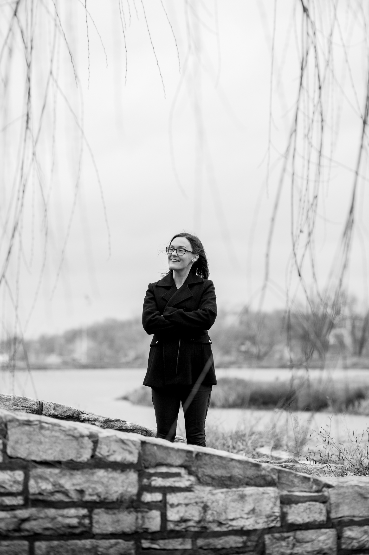  Candid black and white portrait of woman sitting by winter pond, Kansas City lifestyle photographer, Kansas City senior photographer, Kansas City small business headshots, Kansas City lifestyle blogger, candid portrait, winter portrait session, Penn