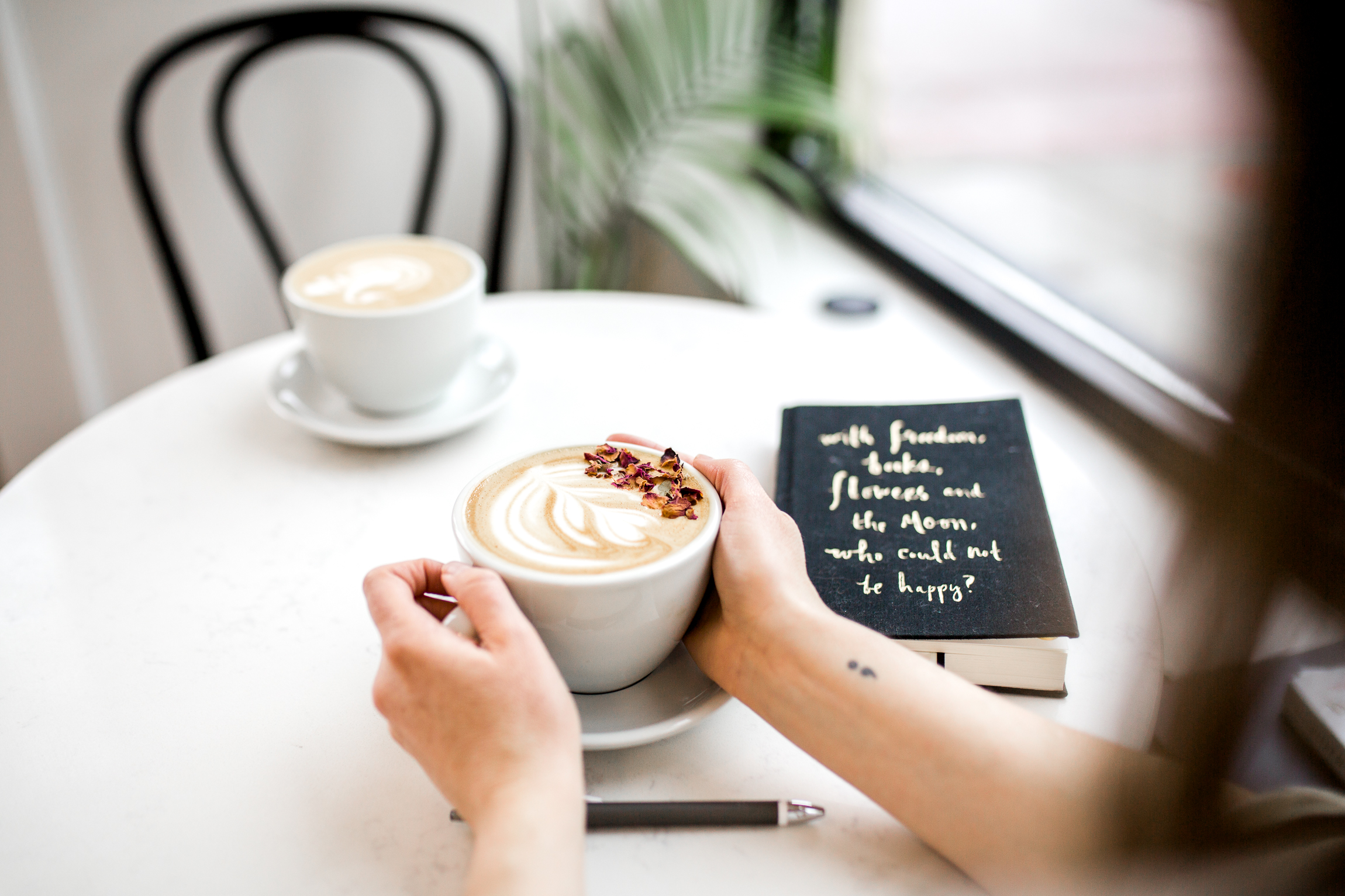  Woman drinking a latte in a coffee shop, Kansas City lifestyle photographer, Kansas City senior photographer, Kansas City small business headshots, Kansas City lifestyle blogger, candid portrait, winter portrait session, Monarch Coffee 