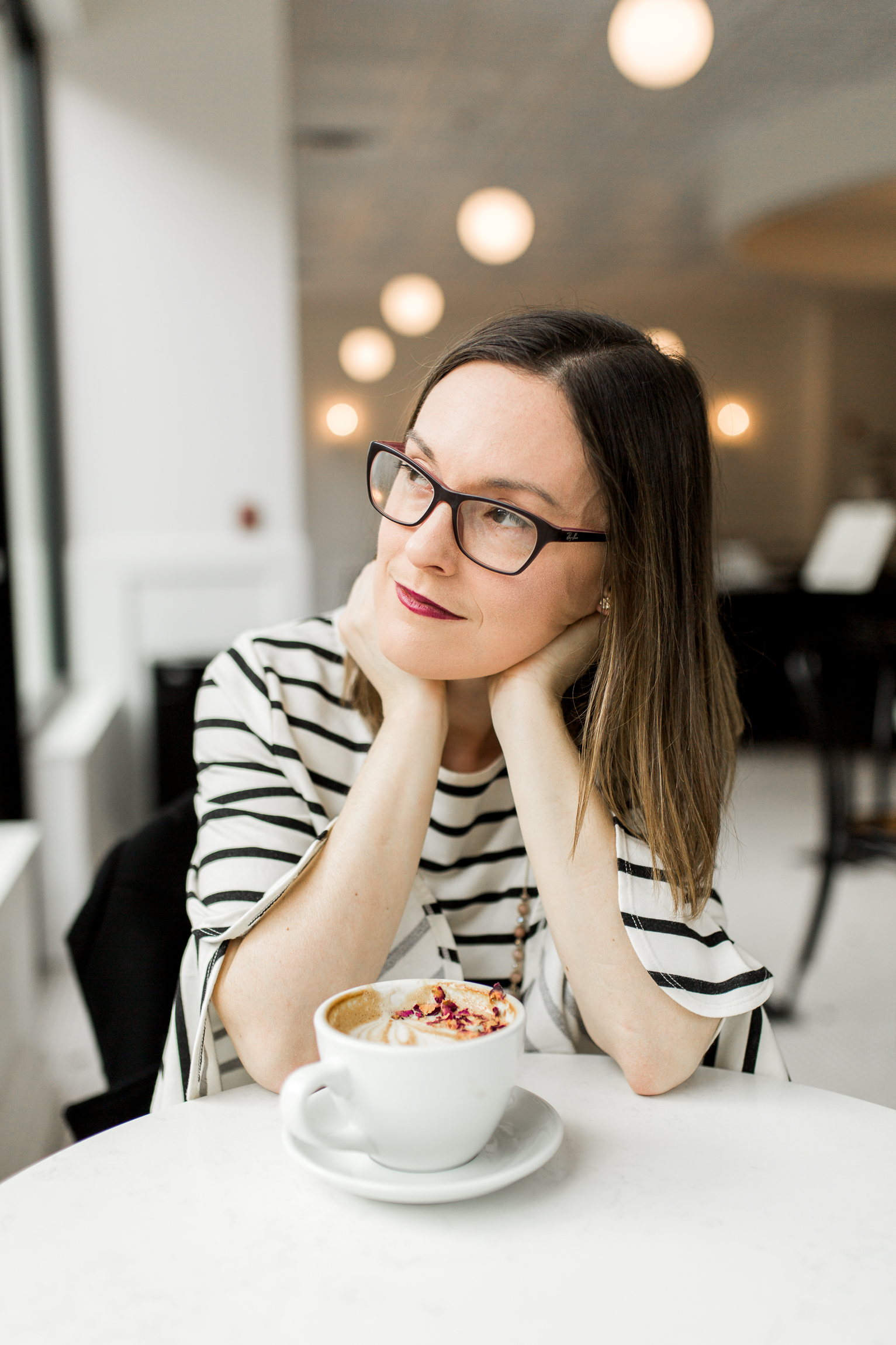  Thoughtful woman with a latte in a coffee shop, Kansas City lifestyle photographer, Kansas City senior photographer, Kansas City small business headshots, Kansas City lifestyle blogger, candid portrait, winter portrait session, Monarch Coffee 