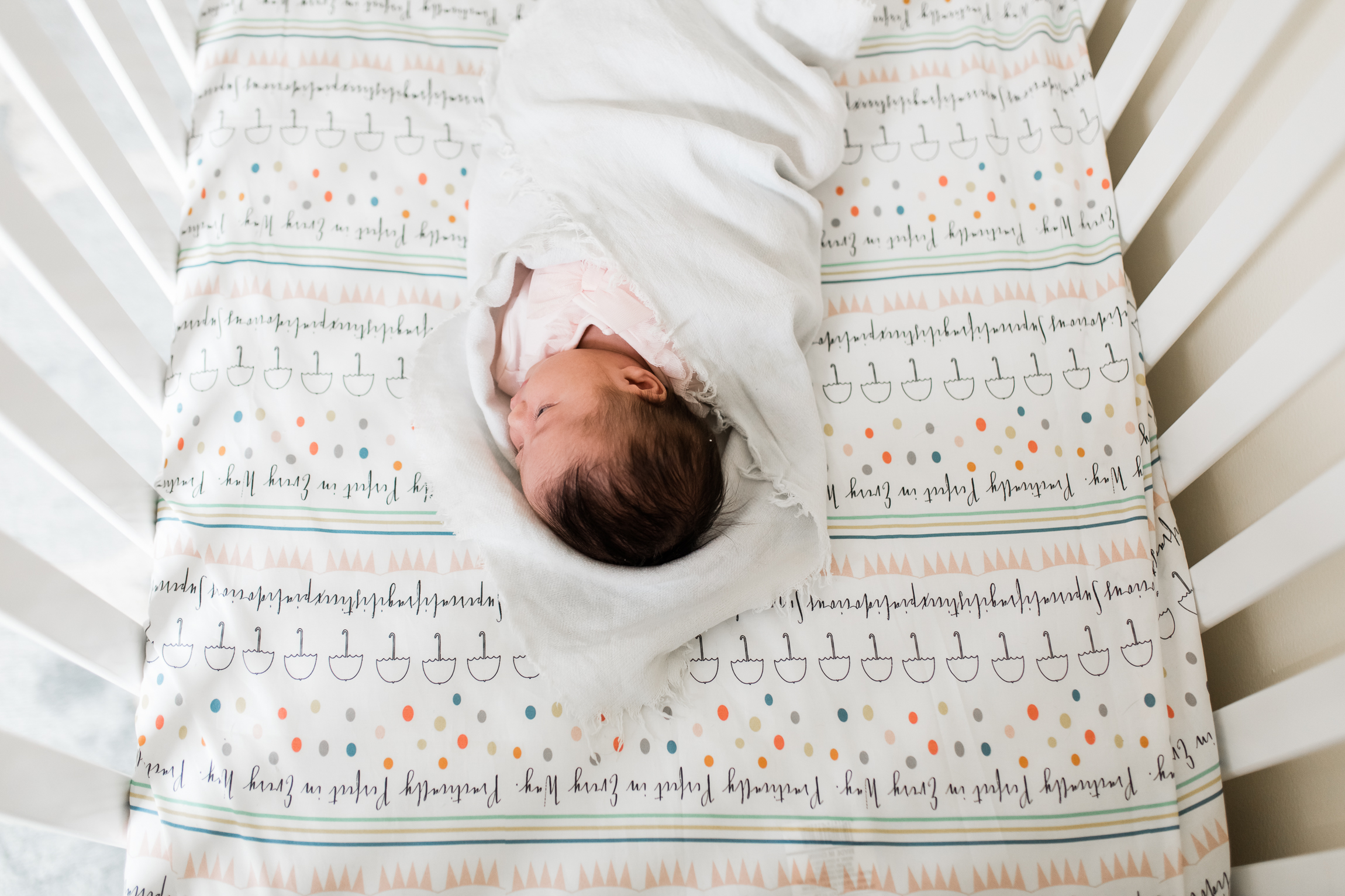  newborn baby in crib, looking down from above, Kansas City lifestyle newborn photographer, in-home newborn session 