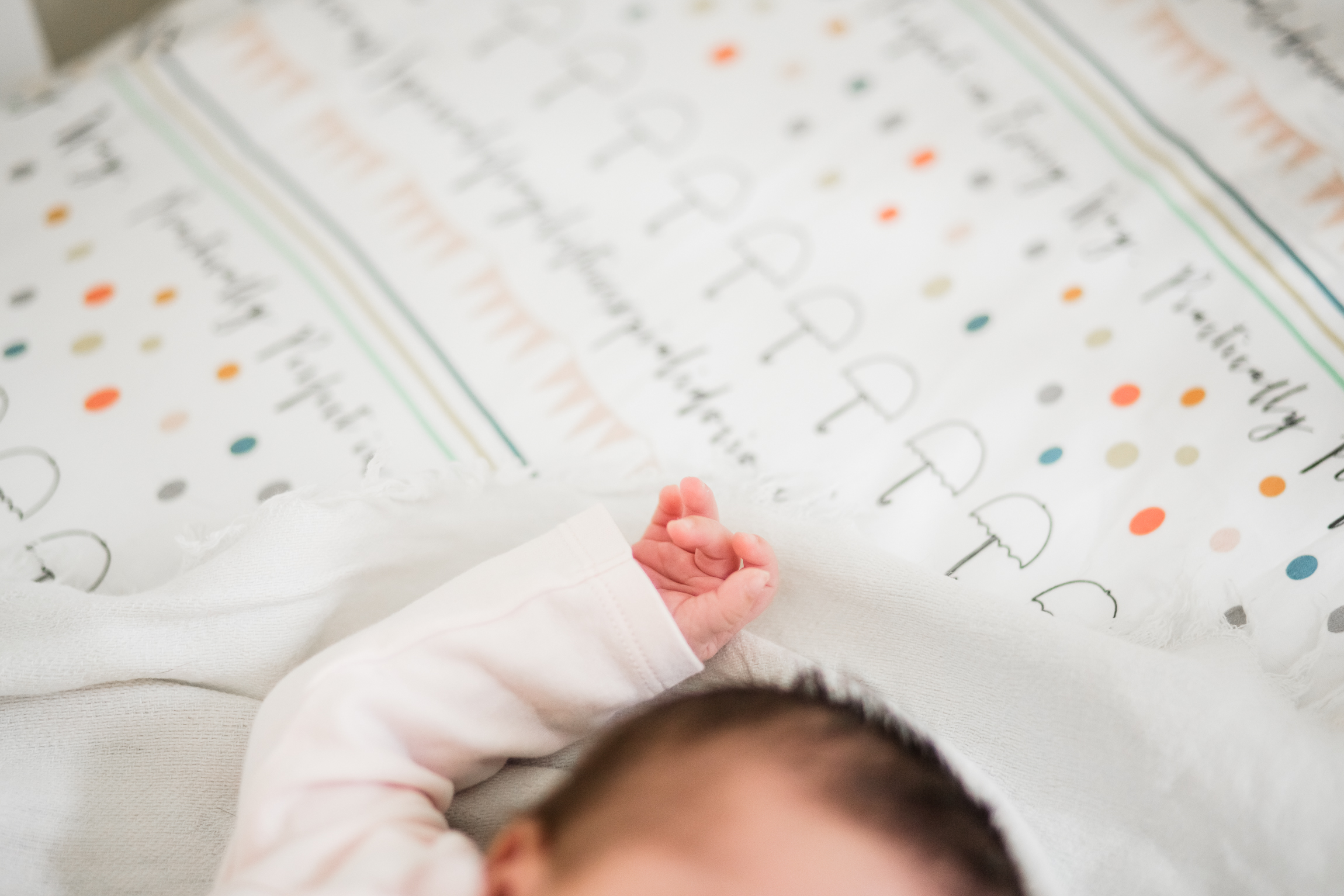  newborn baby in crib, close up of baby fingers, Kansas City lifestyle newborn photographer, in-home newborn session 