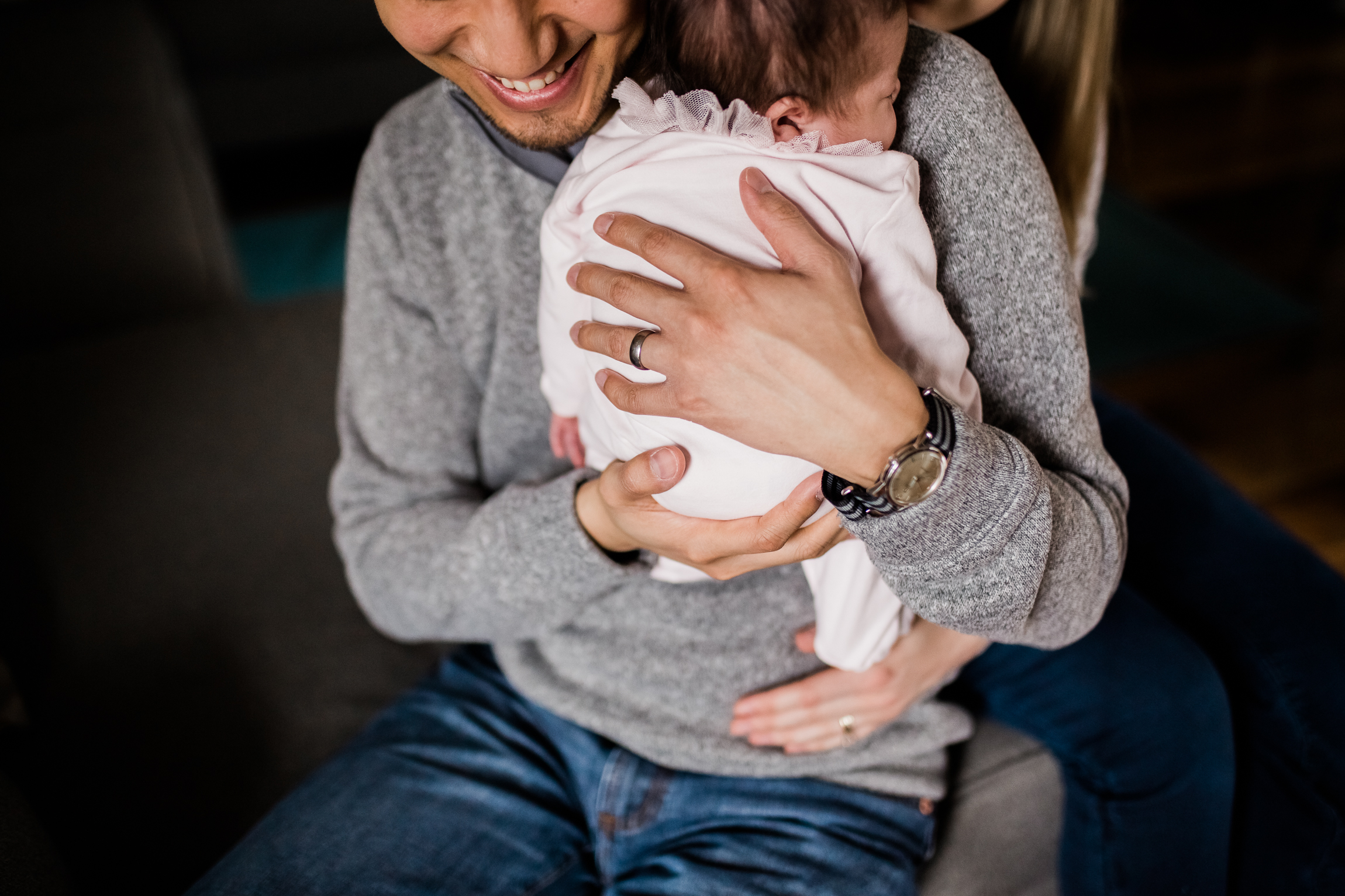  close up portrait of father cuddling his newborn daughter, Kansas City lifestyle newborn photographer, in-home newborn session 