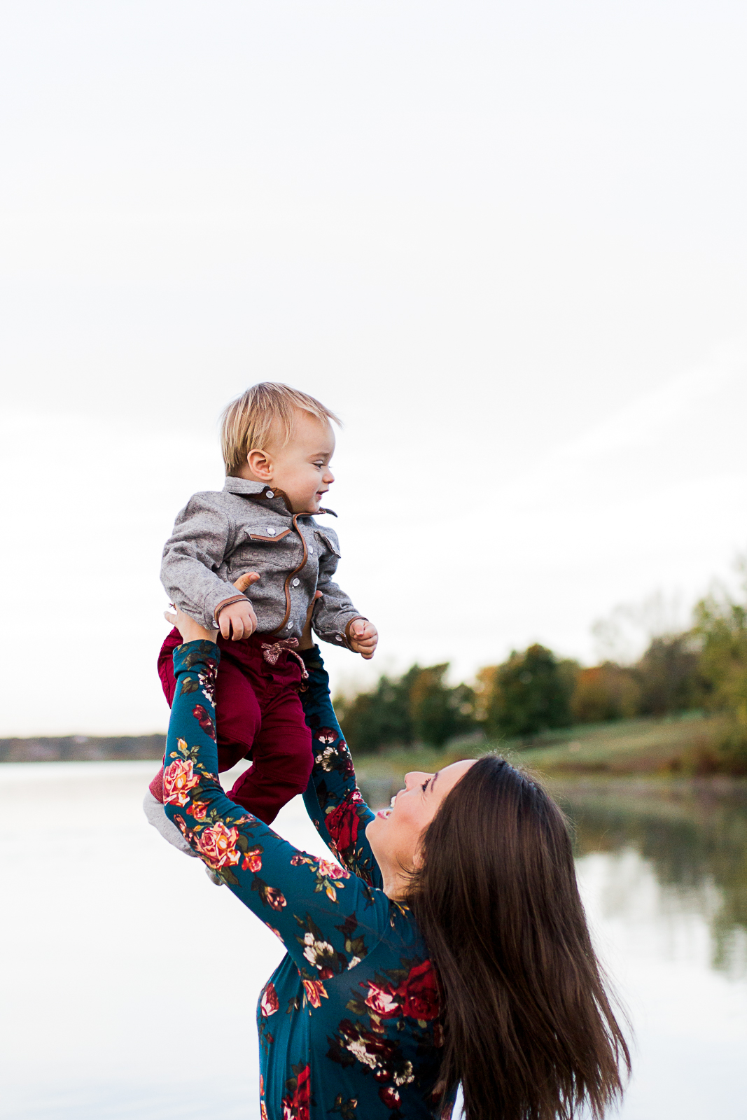  Mother lifts son up in the air, Kansas City family photographer, candid lifestyle photography, mommy and me session, Shawnee Mission Park, Rebecca Clair Photography 