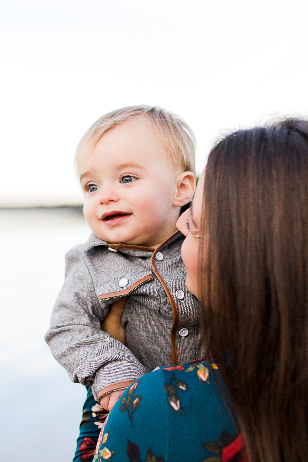  Mother holds son by the lake at sunrise, Kansas City family photographer, mommy and me session.  Shawnee Mission Park, Rebecca Clair Photography 