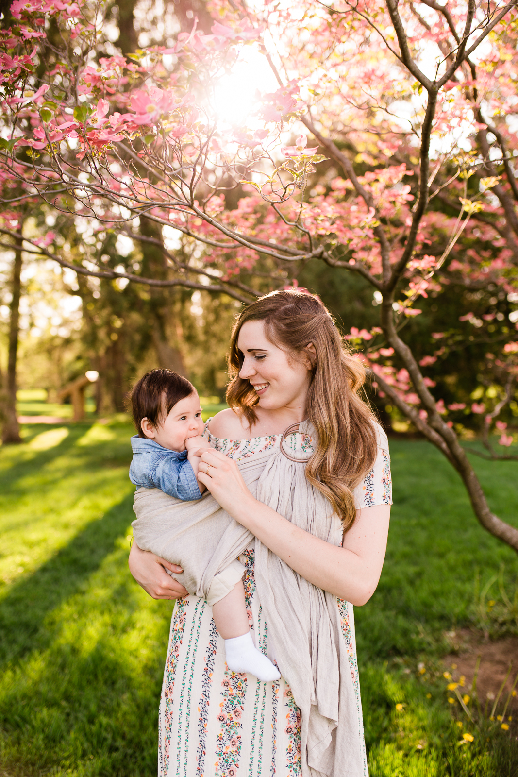  mother holding her baby under a flowering tree, Loose Park mommy and me session, Kansas City family photographer, Rebecca Clair photography 