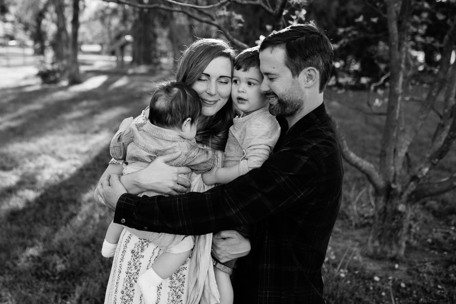  Black and white photo of family hugging, emotional family photos, Kansas City family photographer, Rebecca Clair photography 