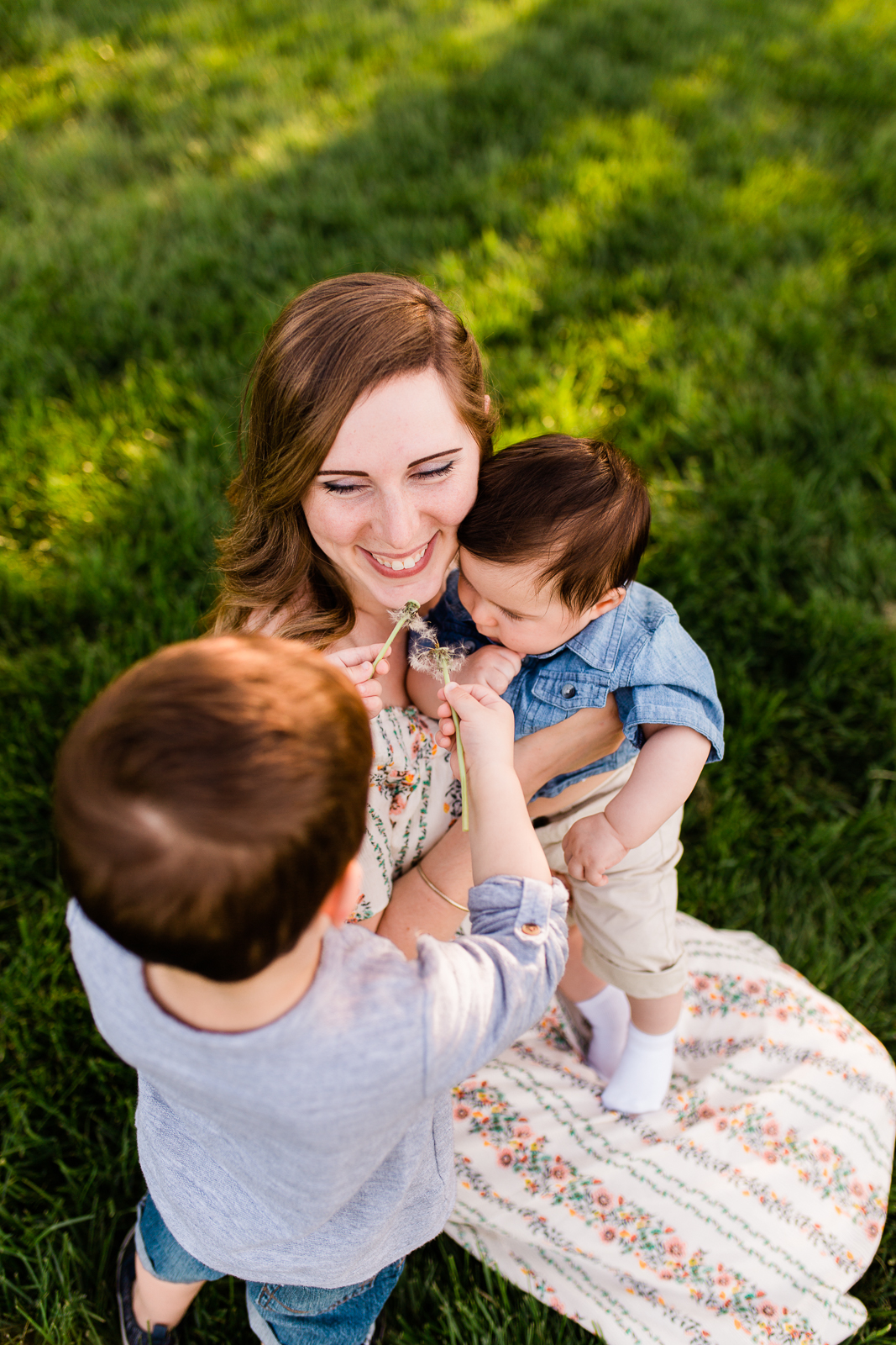  Mother and son blowing dandelions in the golden evening light, candid family photos, Kansas City family photographer, Rebecca Clair Photography 