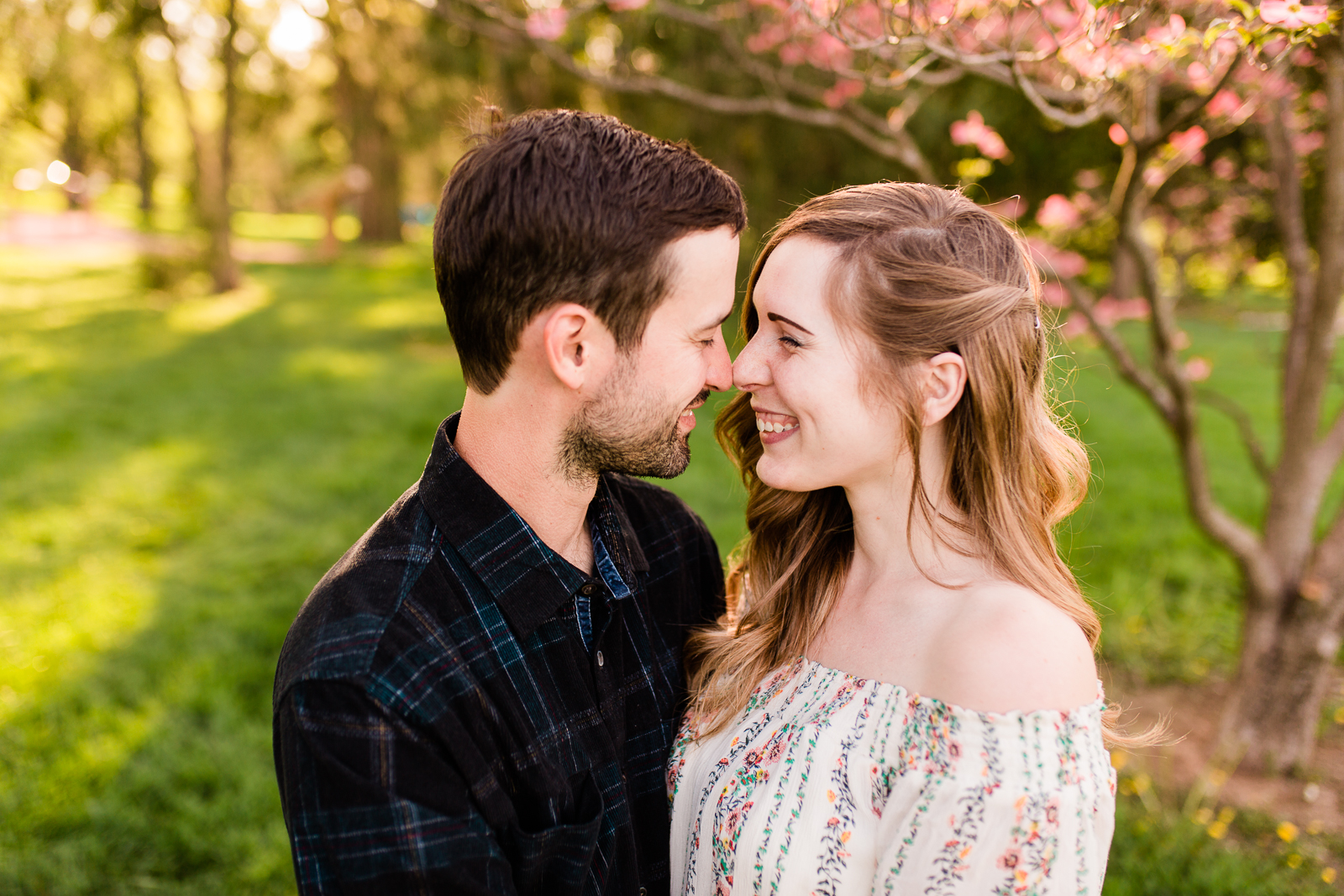  Couple giggling together, spring couples session at Loose Park, Kansas City anniversary session, Rebecca Clair Photography 