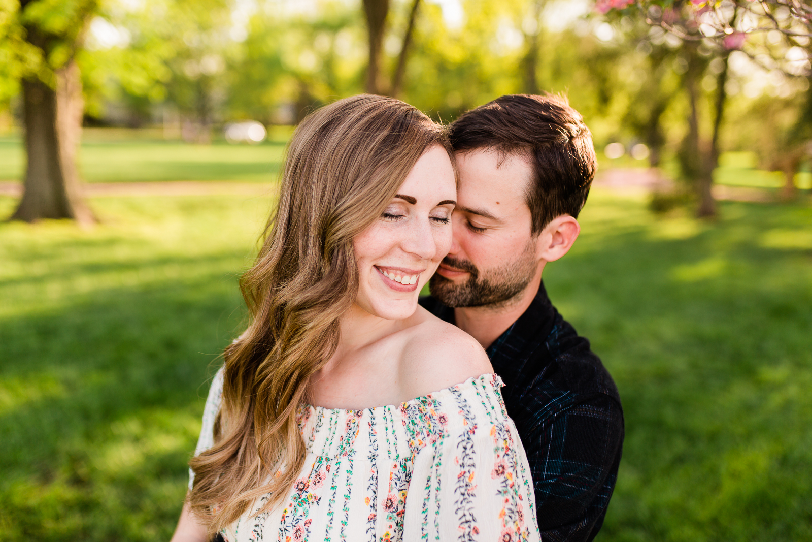  Couple embraces in the golden light, Loose Park spring session, Kansas City couples photographer, Rebecca Clair Photography 