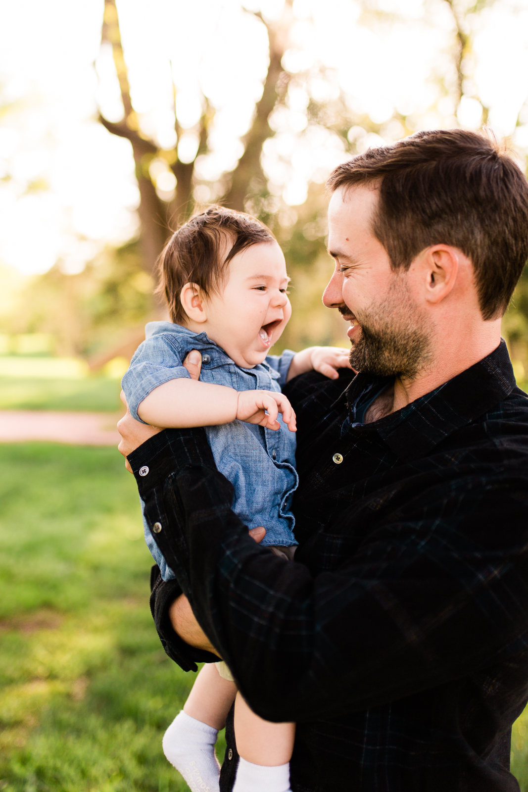  Father holding giggling baby, spring family session at Loose Park, Kansas City family photographer, Rebecca Clair Photography 