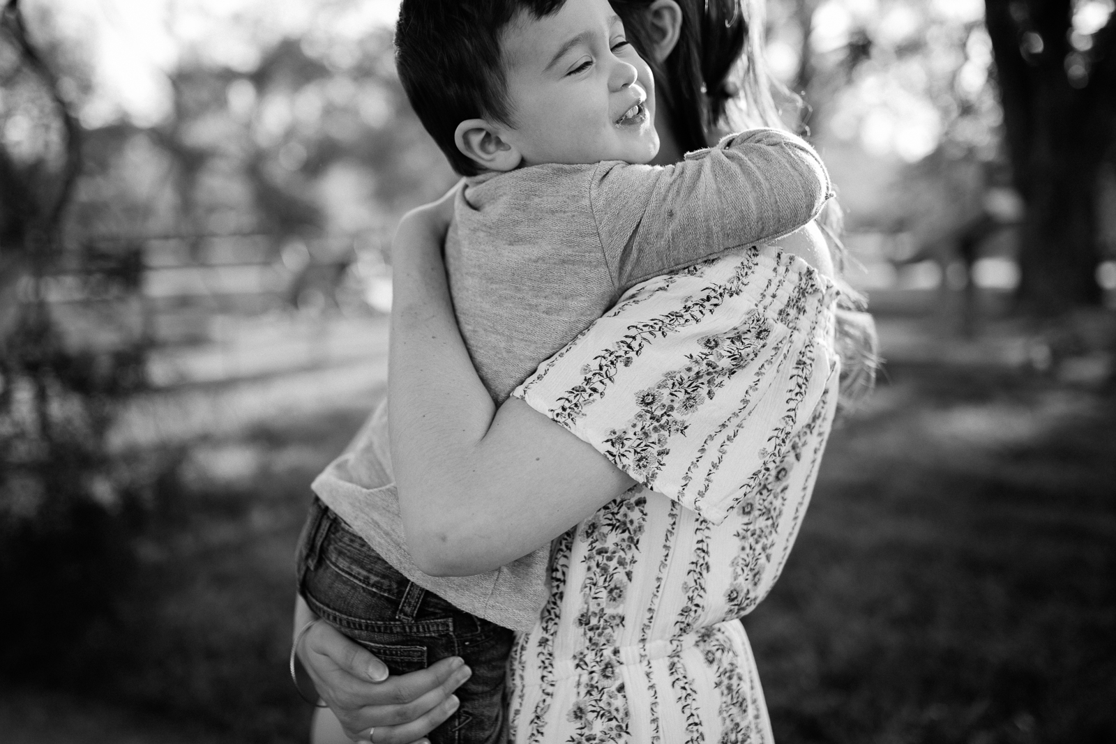  Black and white potrait of son hugging his mother, emotive family photography, Kansas City lifestyle photographer, Rebecca Clair Photography 