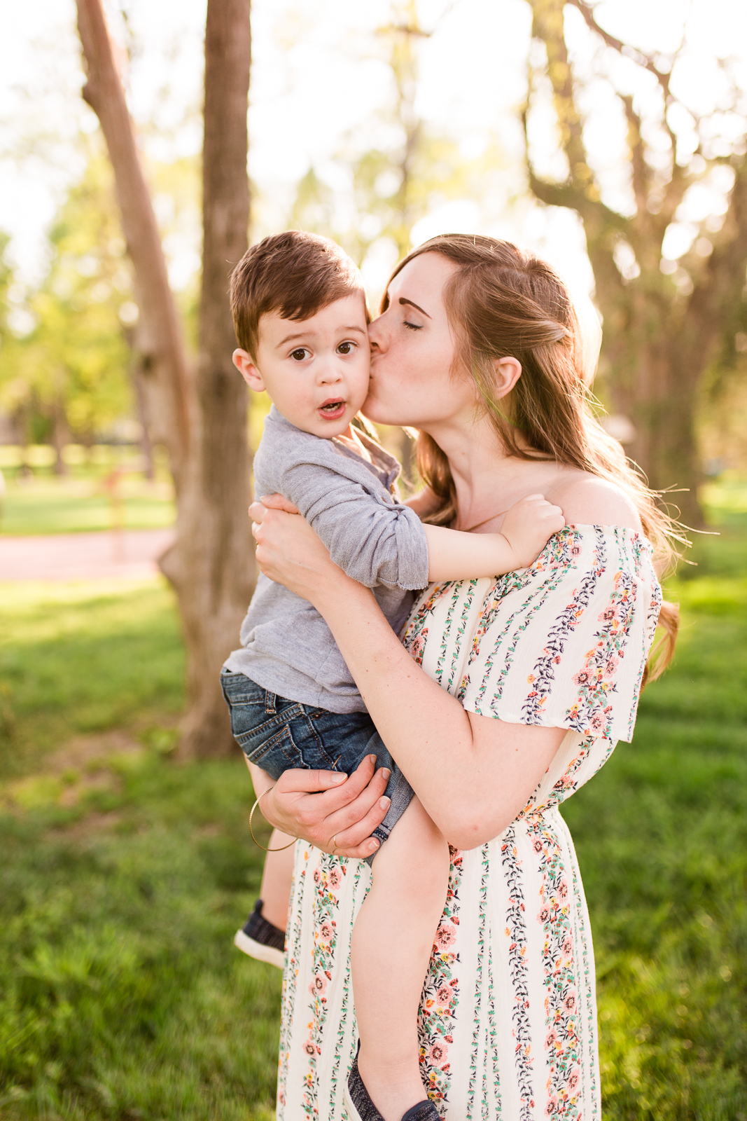  Mother kisses her son in the golden light, Kansas City family photographer, Rebecca Clair Photography 