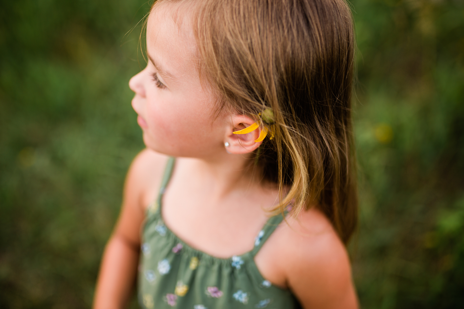  Close up portrait of a girl with a flower behind her ears, mommy and me session at Shawnee Mission Park, Kansas City candid children's portrait photographer 