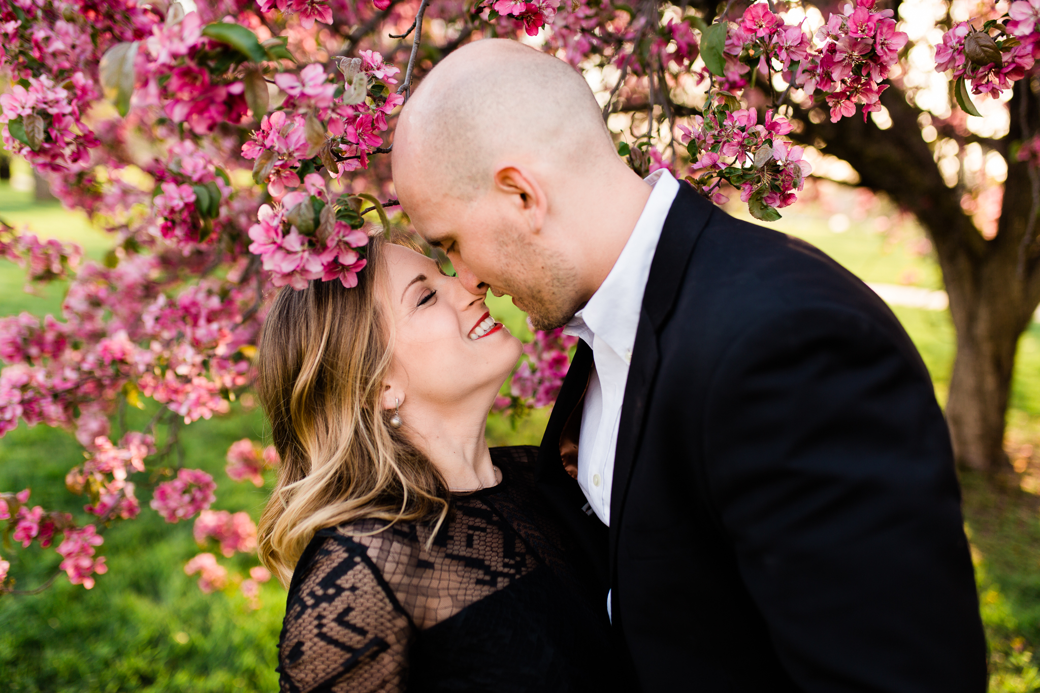  Couple rubs noses in the spring evening light, Kansas City spring engement session, Rebecca Clair Photography 