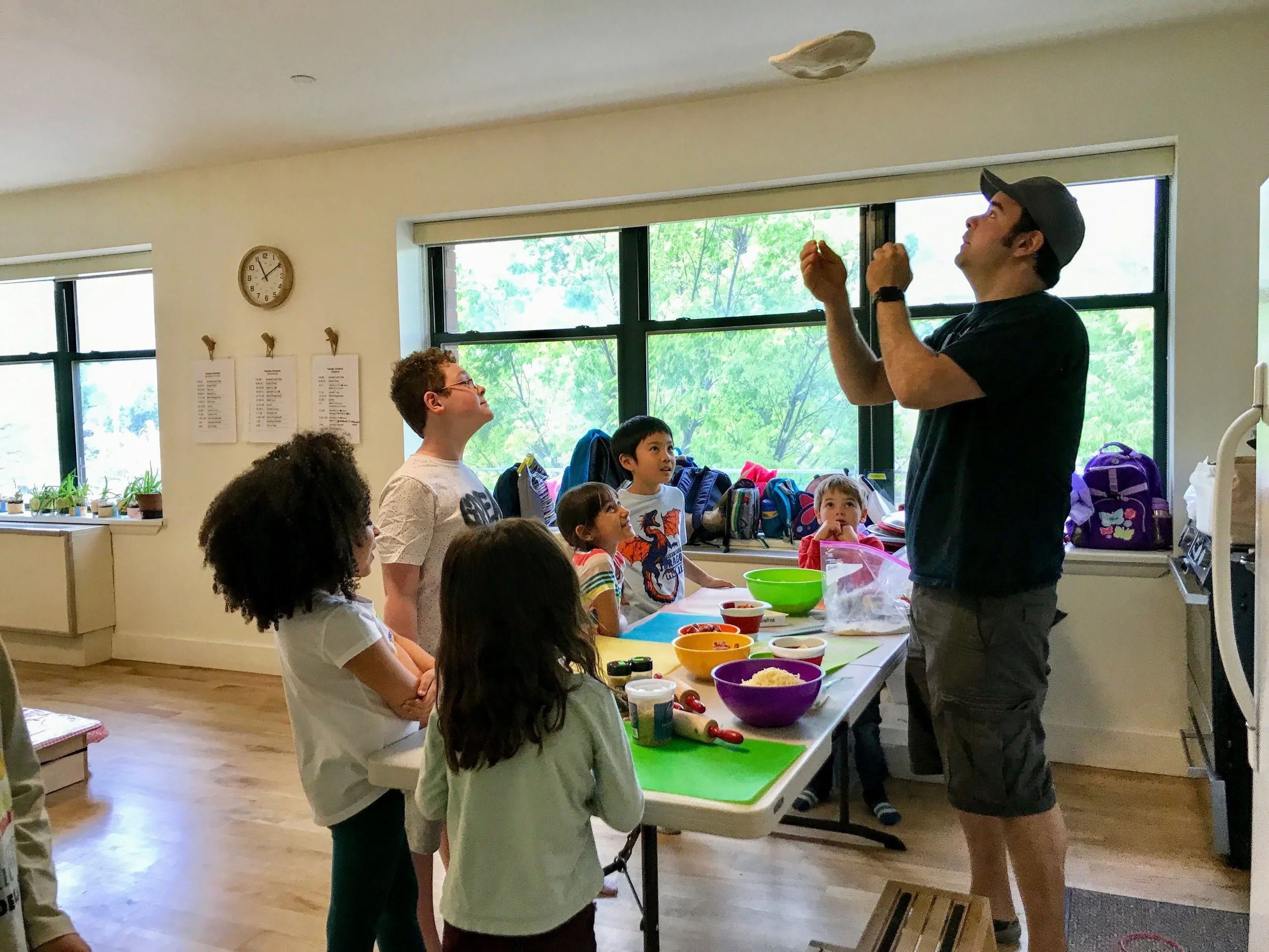 george tossing pizza dough.JPG