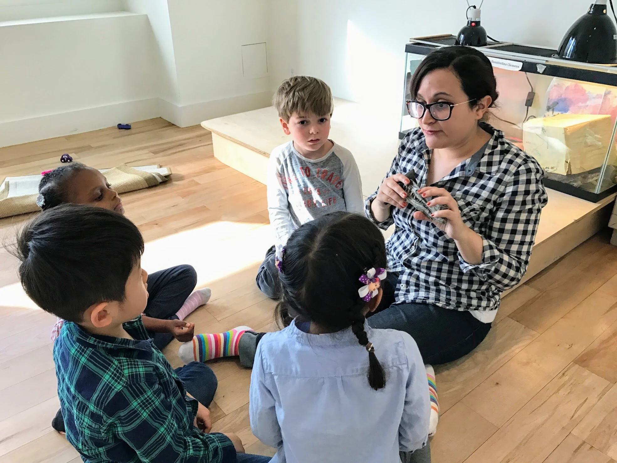 Paleontologist shows dinosaur fossils to alternative school kids and children at Pono