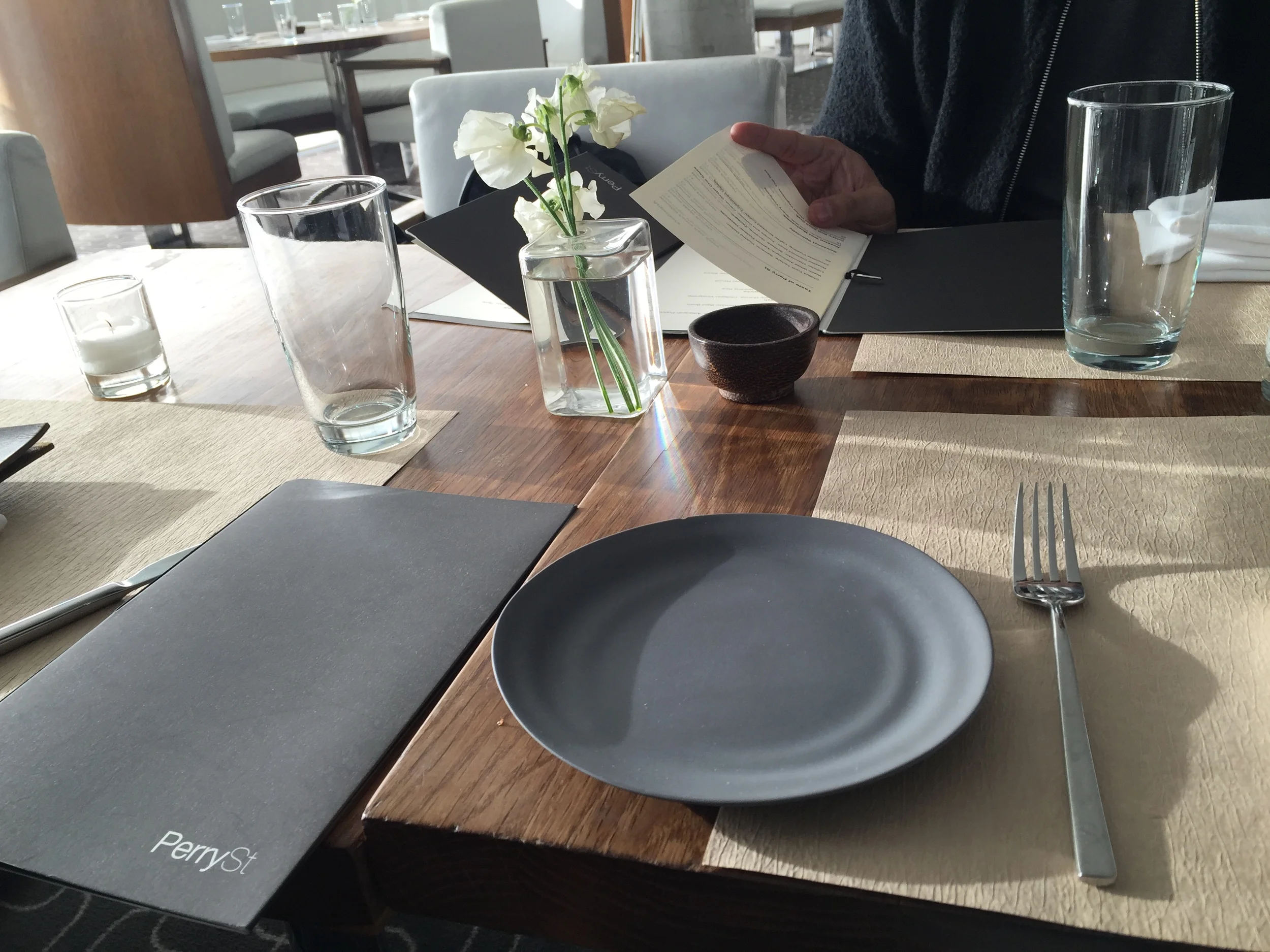 Each table is decorated with vases of flowers