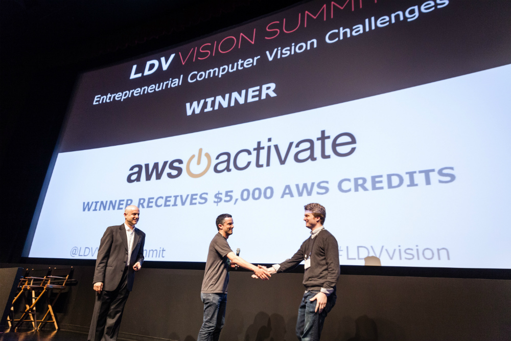 LDV Vision Summit 2016, Entrepreneurial Computer Vision Challenge Winner: Grokstyle, co-founded by Cornell researchers Sean Bell and Kavita Bala. Serge congratulating CEO Sean Bell. ©Robert Wright 