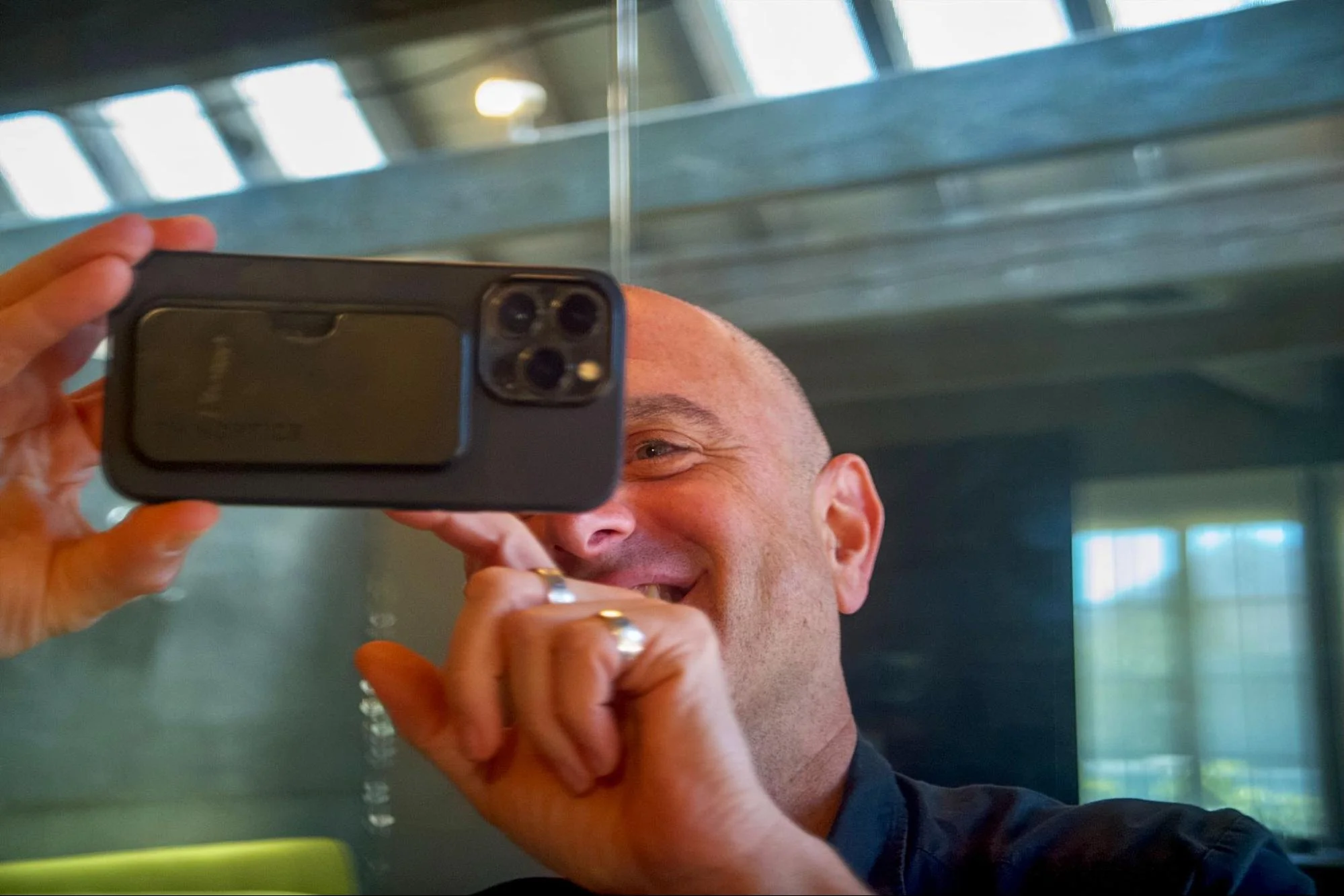 Investor Evan Nisselson holds a phone with a Glass Imaging prototype camera module attached