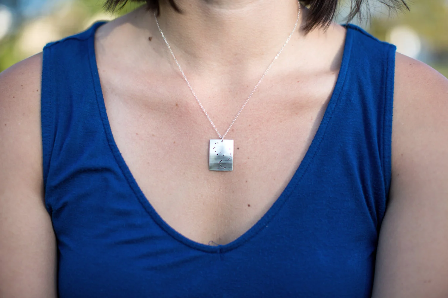 Orion constellation sterling silver rectangle necklace on model