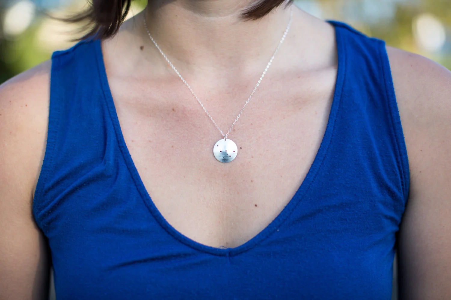 Cassiopeia constellation sterling silver necklace on model