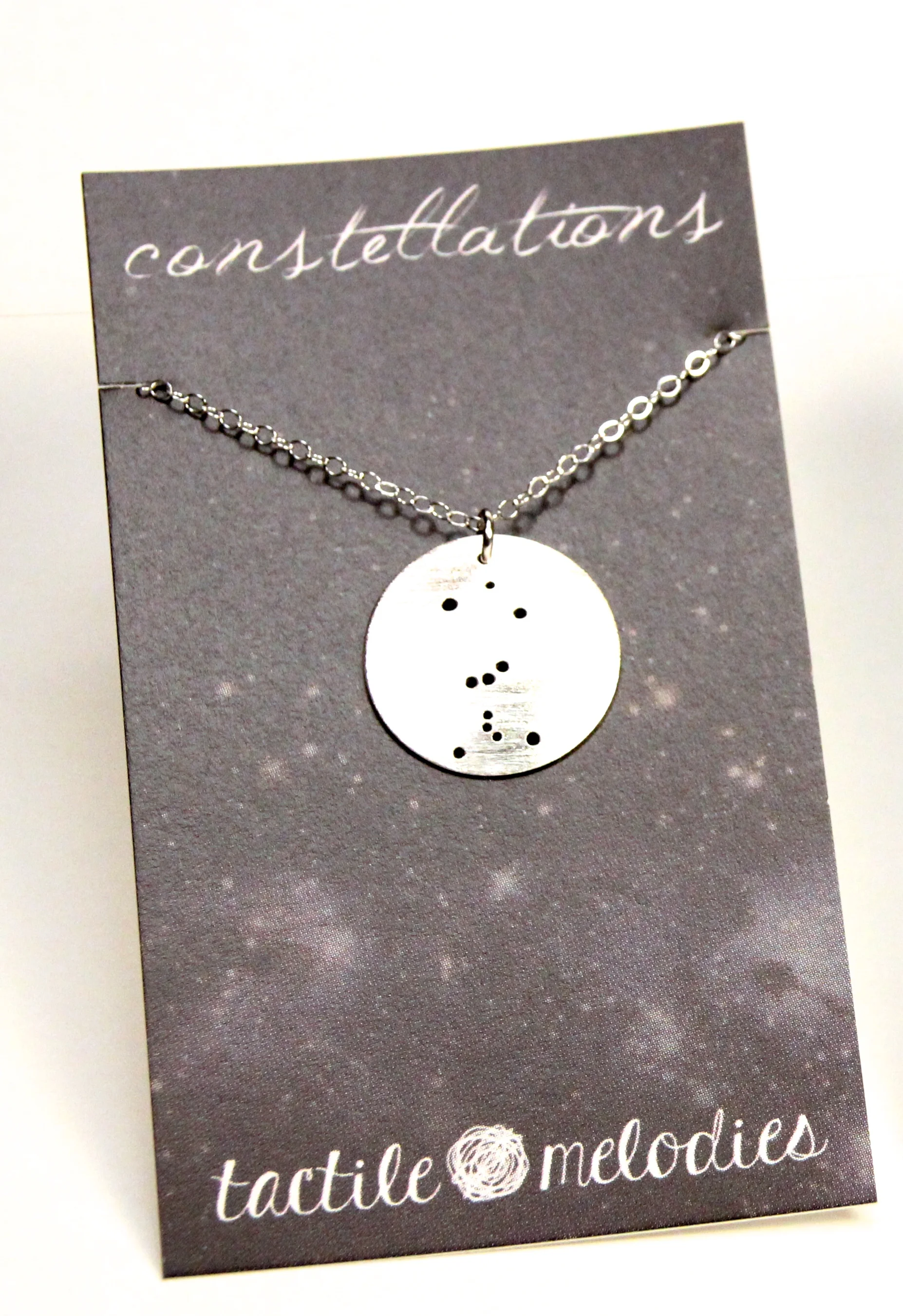 Orion's Belt constellation round sterling silver necklace on card