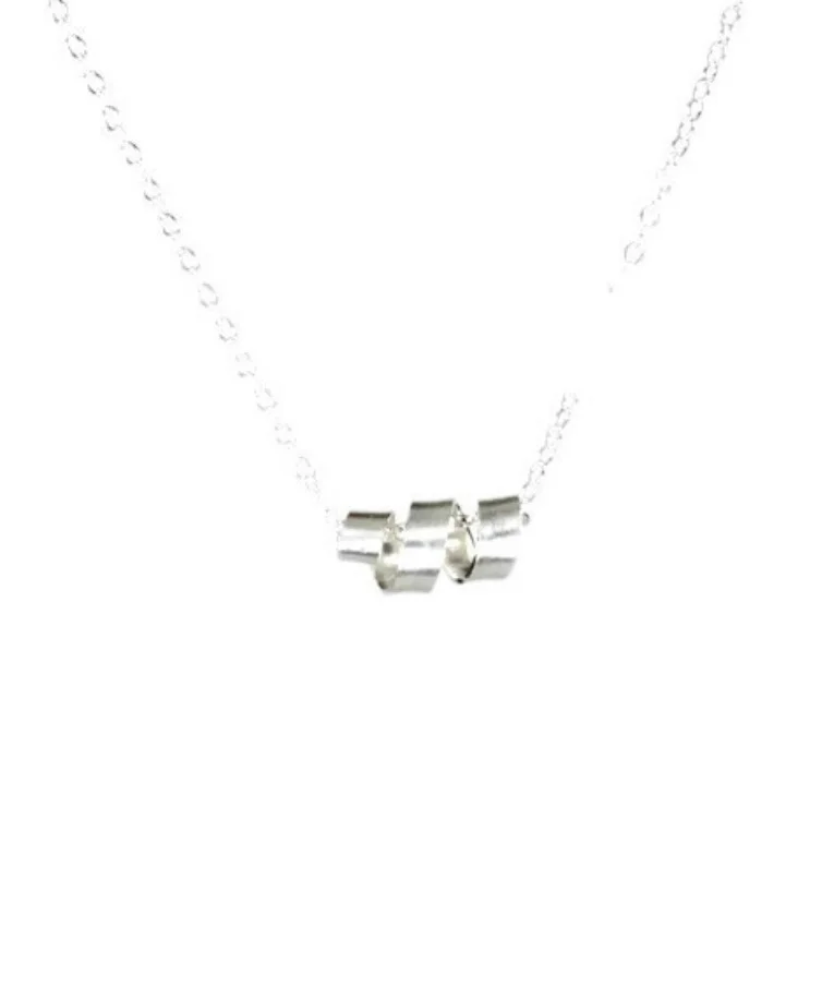 Pendant is a strip of silver twisted into a corkscrew curl shape. The silver is shiny and smooth with a lightly brushed finish. Pendant is wrapped horizontally around a bright silver open-link chain.